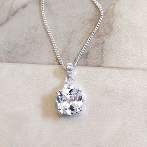NVC faux diamonds pendant on faux silver chain.